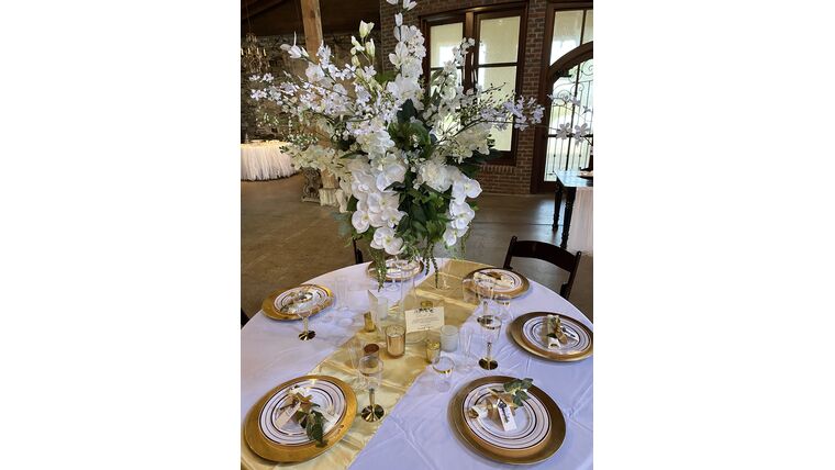 Tall Glass Vases with Beautiful Floral Arrangement Centerpieces rental for events in Atlanta