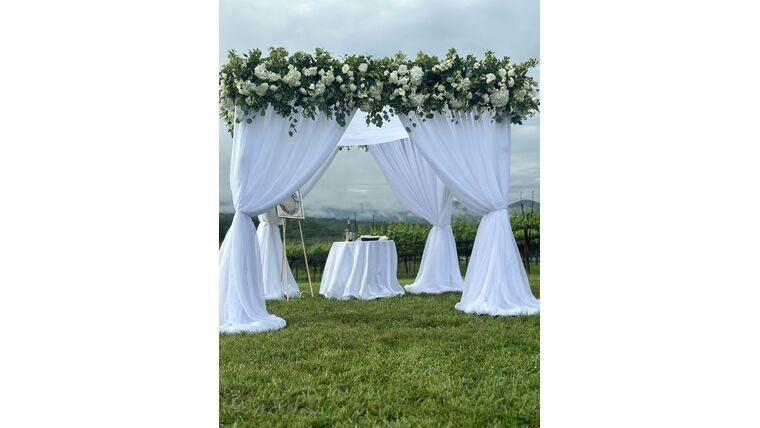 Adding Draping Canopy to Chuppah Drape rental for events in Atlanta