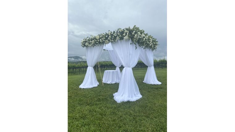 Adding Draping to Chuppah Drape rental for events in Atlanta