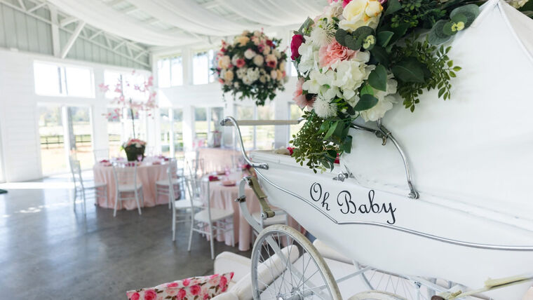 Decor- Antique Silver Cross Baby Carriage White Props rental for events in Atlanta